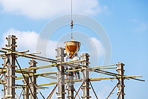 Crane working in construction on blue sky