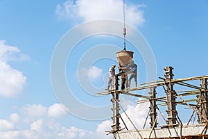 Crane working in construction on blue sky