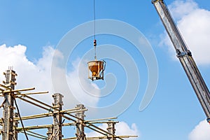 Crane working in construction on blue sky