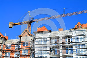 A crane working on the upper floors