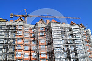 A crane working on the upper floors