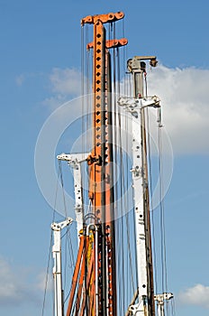 Cranes against blue sky