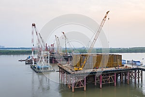 Cranes on bridge construction site