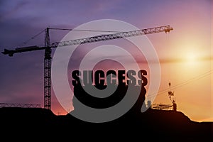 Cranes building construction, cooperate for successful work.
