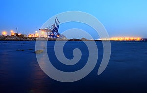 Cranes at the cargo terminal in the evening