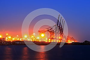 Cranes at the cargo terminal in the evening