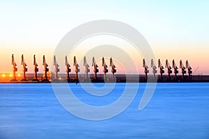 Cranes at the cargo terminal in the evening