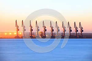 Cranes at the cargo terminal in the evening