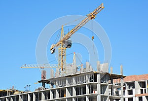 Cranes construction. Building construction growth and global construction industry concept