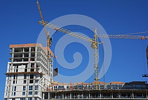 Cranes construction. Building construction growth and global construction industry concept