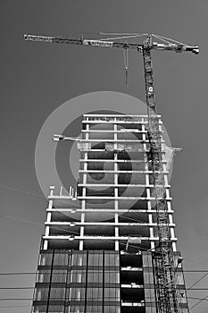 cranes at the construction site of an office buildingg in Poznan