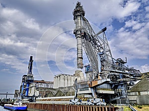 Cranes on a dock for loading ships with grain