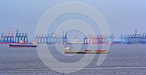 Cranes on dockside of commercial port.