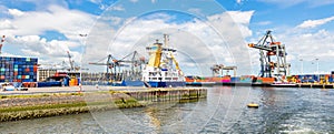 Cranes at harbor of Rotterdam, Netherlands. Logistics business, cargo loading unloading