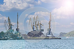 cranes are lifted by scrap metal in seaport