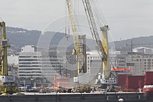 Cranes loading ship at the loading dock in the port of A CoruÃÂ±a