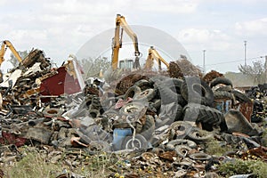 Cranes Moving Waste at the Scrap Yard