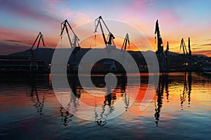 Cranes in Sestao at sunset