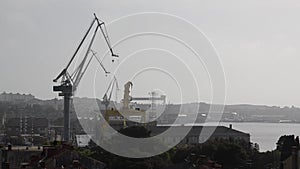 Cranes in Shipyard at sunset. Harbour in Adriatic sea. Jackup rig, Oil platform and Container crane in Dockyard. Ship port. Indust