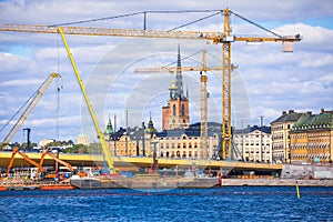 Cranes at Stockholm city Gamla Stan island construction site view