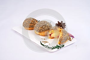 Craquelin or French Crunchy Cream Puff filled photo