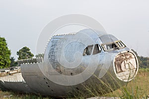 crash-landed aircraft. airplane wreckage in jungle - old propeller aircraft in forest. an airplane tail in a plane crash site.