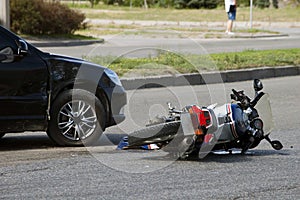 Crash moto bike and car on road