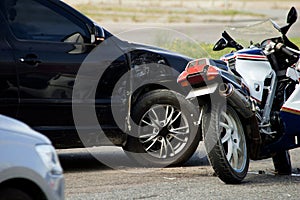 Crash moto bike and car on road