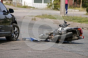 Crash moto bike and car on road