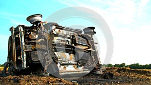 Crashed car in field