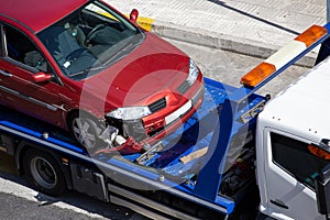 Crashed car loaded on a tow truck