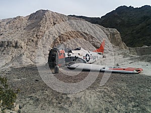 Crashed Navy plane on small desert hill