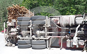 Crashed overturning truck on road