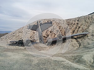 Crashed plane on small desert hill
