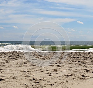 Crashing ocean waves on a sandy beach