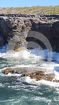 Crashing Waves Along a Rocky Cliff