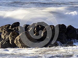 Crashing waves on the beach in massa photo