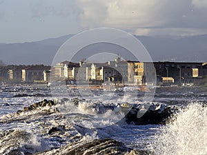 Crashing waves on the beach in massa photo