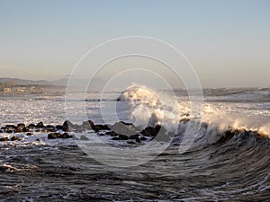 Crashing waves on the beach in massa photo