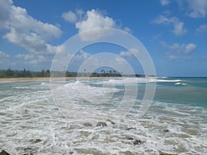 Crashing waves on the beach shore of Aguada Puerto Rico photo
