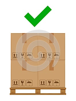 Crate boxes on wooded pallet and check mark green for product arrangement concept, stack cardboard box in factory warehouse