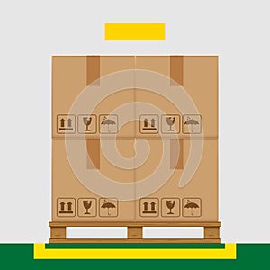 Crate boxes on wooded pallet and yellow marking area for products arrangement concept, stack cardboard box in factory warehouse
