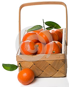 Crate of ripe tangerines with leaves