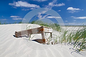 Crate washed ashore, lying on dune