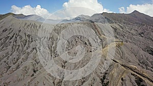 Crater with active volcano smoke in East Jawa, Indonesia. Aerial view of volcano crater Mount Gunung Bromo is an active