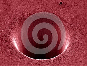 Crater in Ti drilled by laser beam