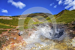 Craters with boiling volcanic mud. Iturup, Kuril Islands