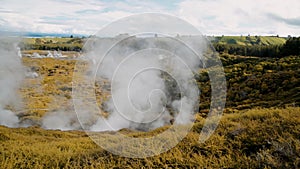 Craters of The Moon Geysers Park, New Zealand. Steam from geothermal valley. Slow motion