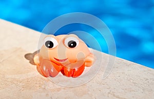 Craw fish toy near the pool photo