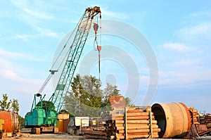 Crawler crane on the construction site for loading and unloading and construction works for laying sewer pipes